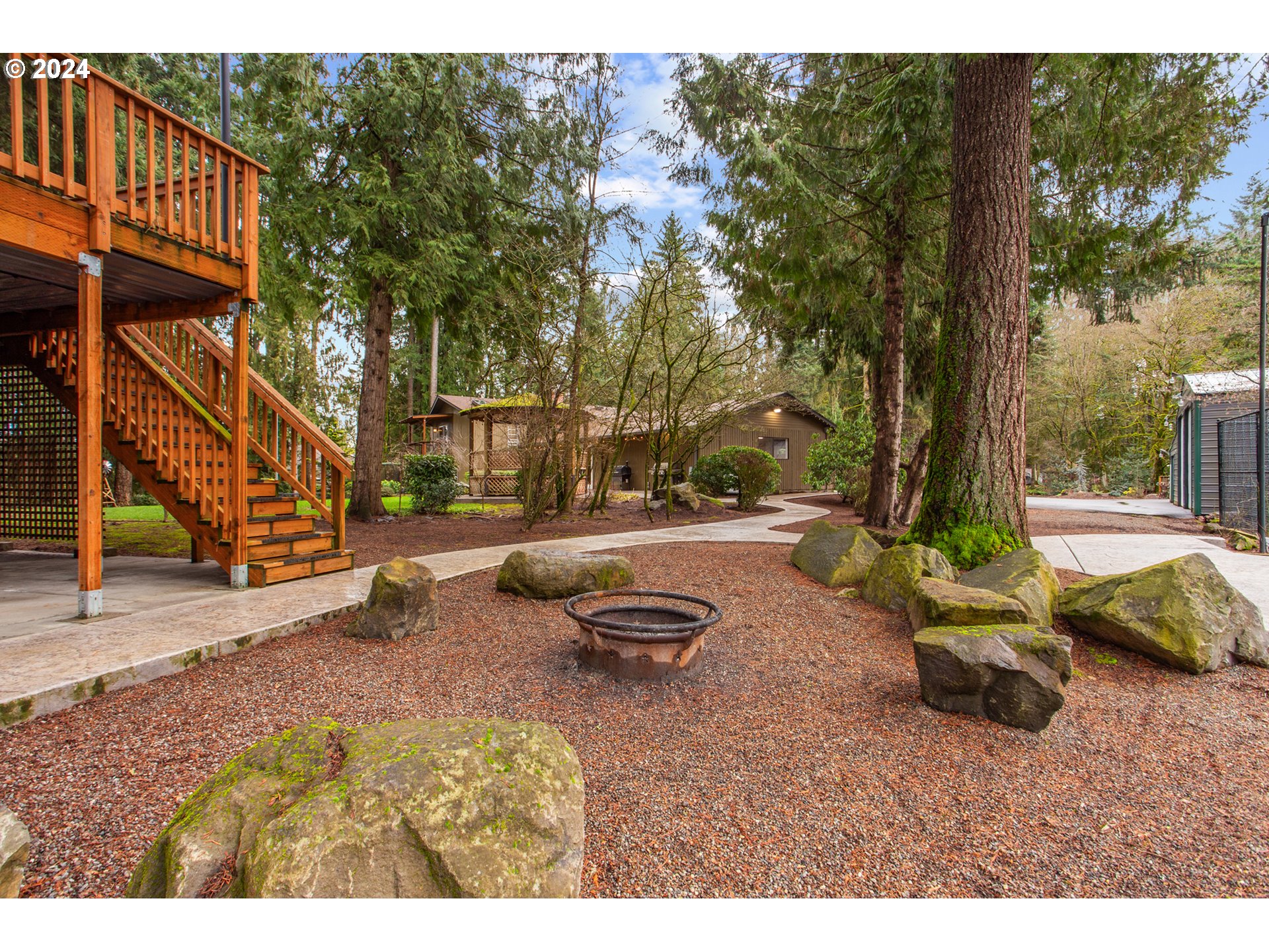 3308 Northwest 203rd Street Ridgefield, WA 98642 - Photo 8 of 41 a swimming pool with outdoor seating and yard