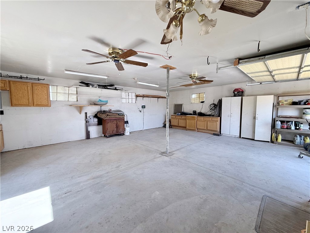 4501 East Kellogg Road Pahrump, NV 89061 - Photo 25 of 52 Ample work and storage space is available in this functional, well-lit garage.