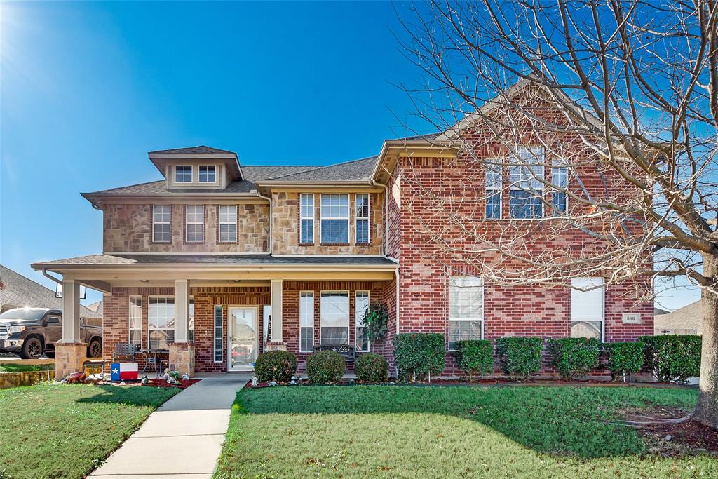 front view of a building with a yard