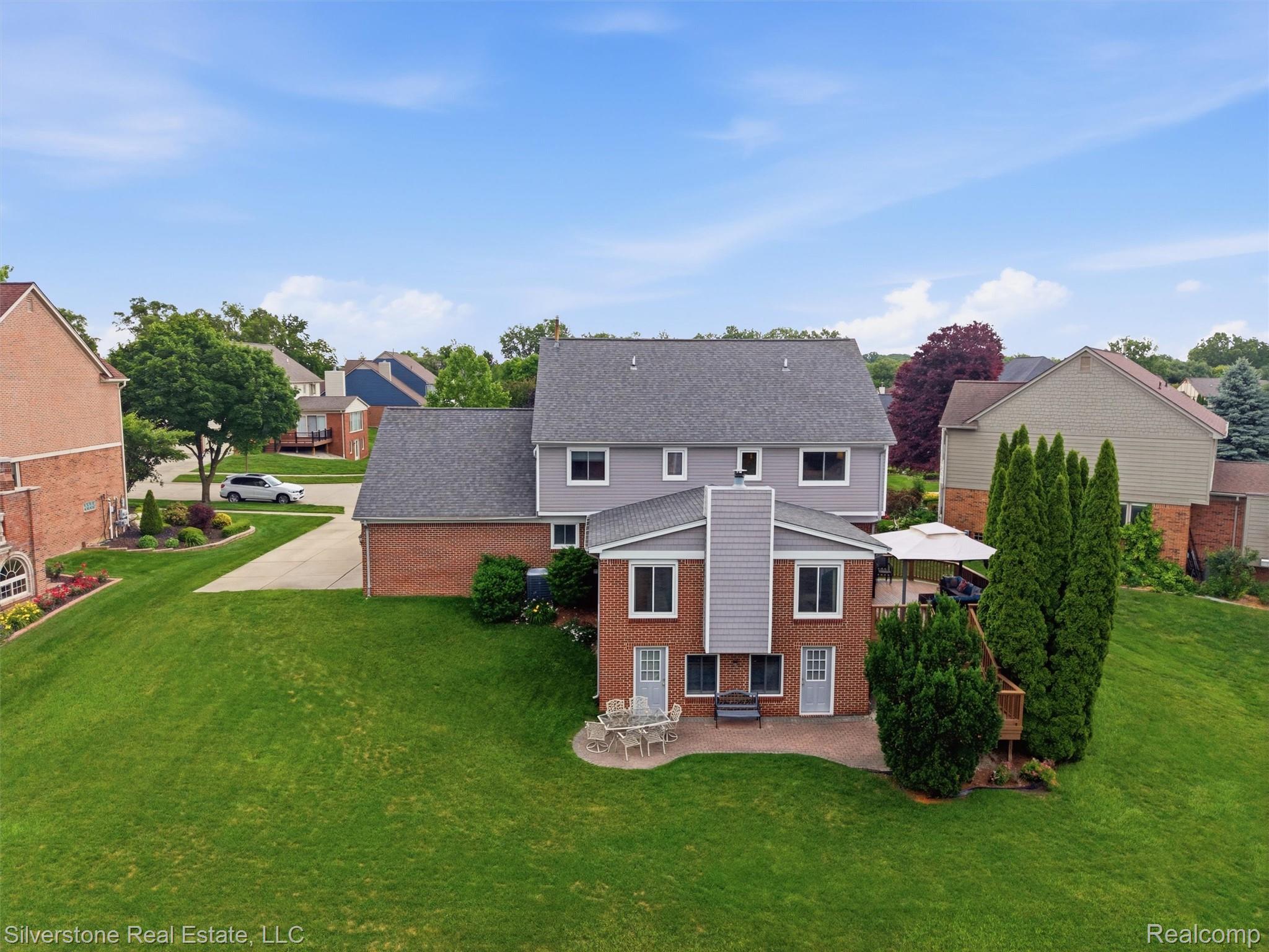 6577 Edith Court Troy, MI 48085 - Photo 56 of 61 Expansive rear exterior featuring a two-story design with brick and siding facades