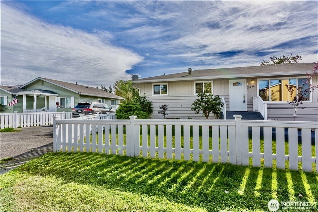 a view of front of house with a yard