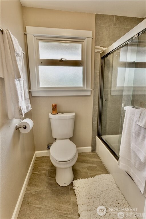 2241 South 252nd Street Des Moines, WA 98198 - Photo 12 of 25 a bathroom with a toilet and a shower