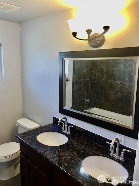 2241 South 252nd Street Des Moines, WA 98198 - Photo 24 of 25 a bathroom with a granite countertop sink and a mirror