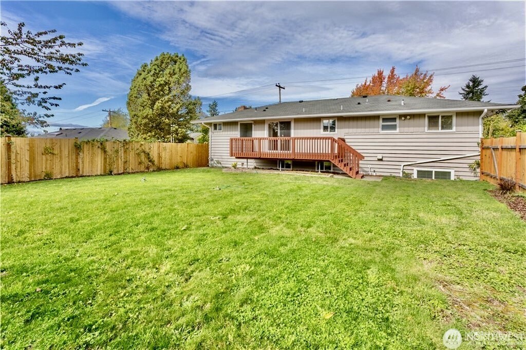 2241 South 252nd Street Des Moines, WA 98198 - Photo 3 of 25 a view of a house with a backyard