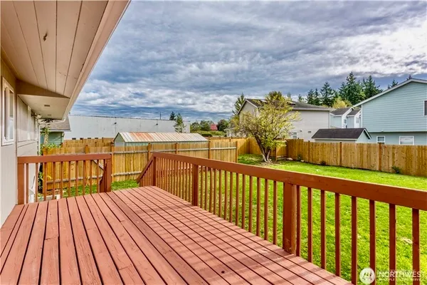 a view of a balcony with wooden floor