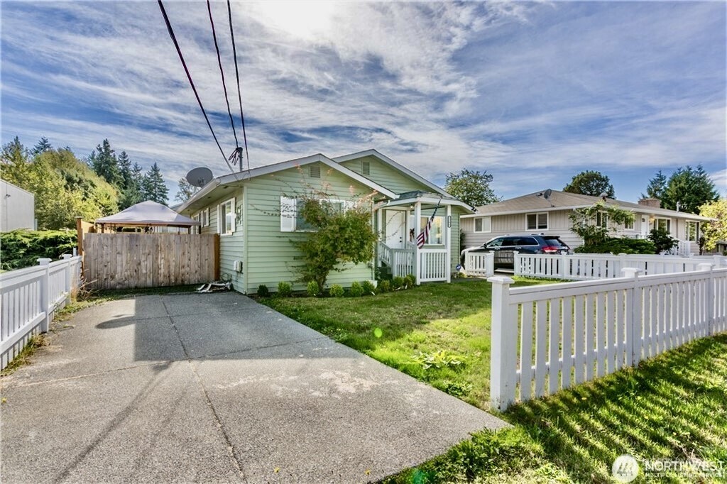 2241 South 252nd Street Des Moines, WA 98198 - Photo 5 of 25 a front view of a house with garden