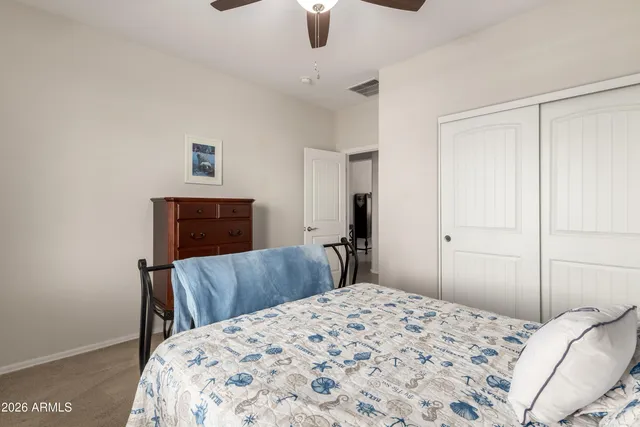 a view of a lake with houses in the back