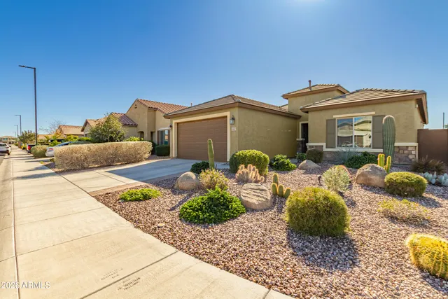 a kitchen with granite countertop stainless steel appliances stove top oven and cabinets