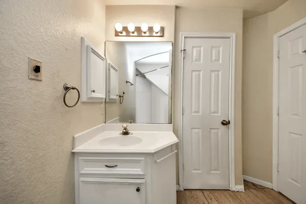 a bathroom with a sink and mirror