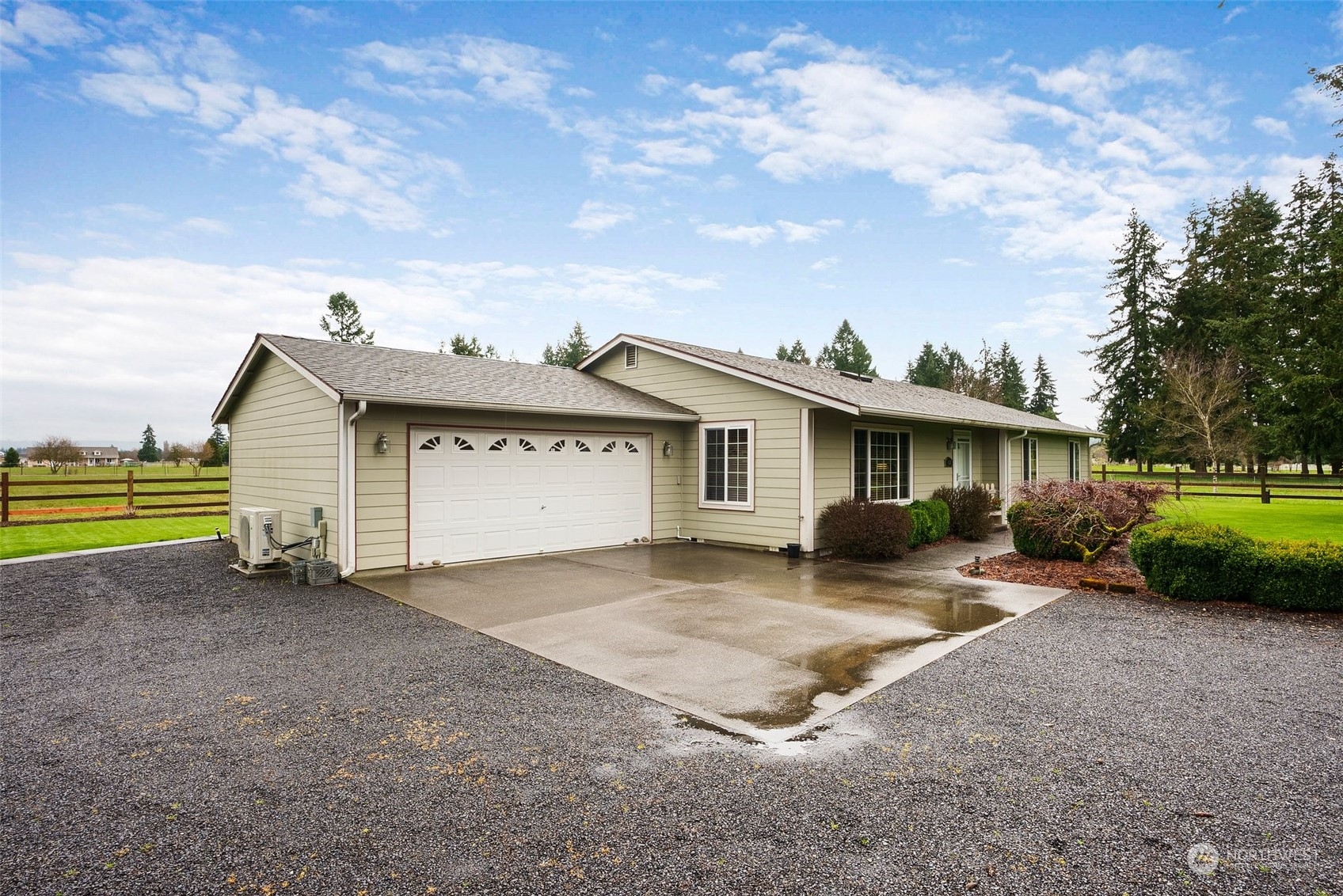 4320 169th Avenue Southwest Rochester, WA 98579 - Photo 3 of 28 a view of a house with a yard and lawn chairs with a fire pit