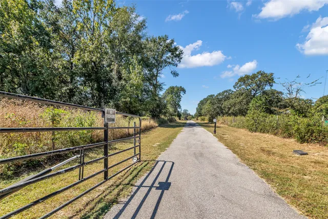 a view of a balcony with trees