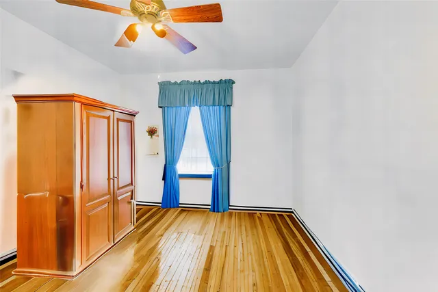 a bathroom with a sink mirror vanity and toilet
