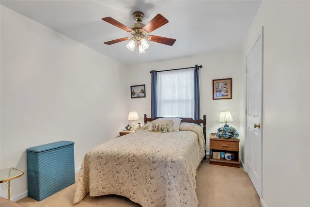 a living room with furniture a rug and a window