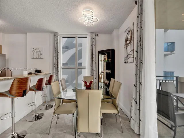 a view of a kitchen with cabinets and a stove