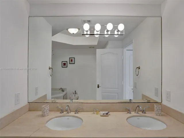 a bedroom with a bed and a cabinet