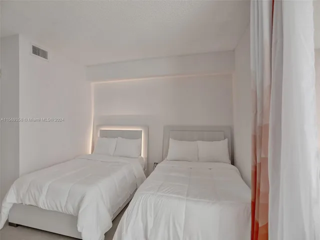 a living room with a couch and a rug