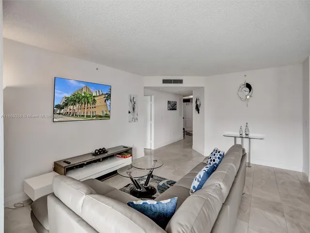 a kitchen with a refrigerator and a sink