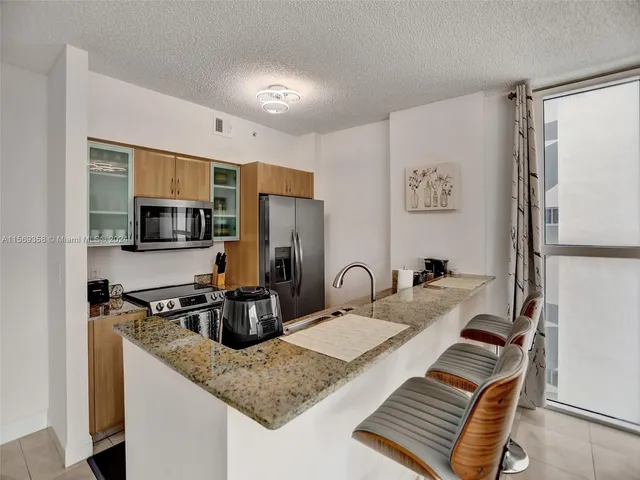 a kitchen with a sink and a window
