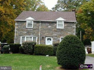 400 Garden Road Springfield, PA 19064 - Photo 1 of 1 a front view of a house with a yard