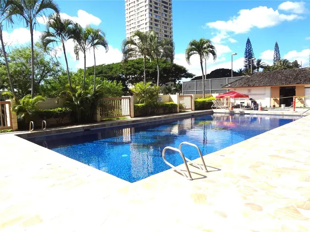 a view of swimming pool with outdoor seating