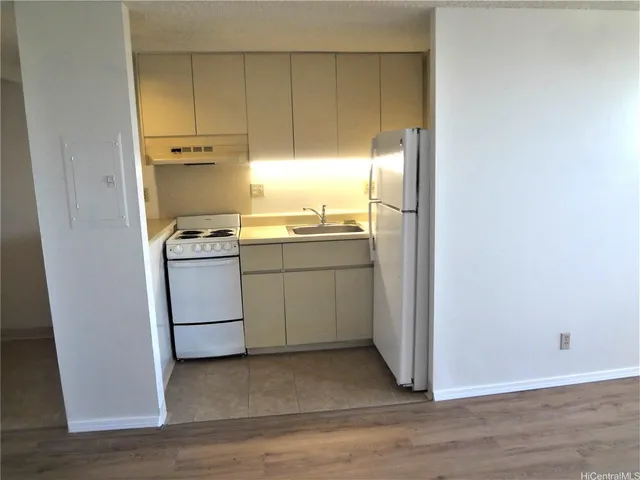 a utility room with sink dryer and washer