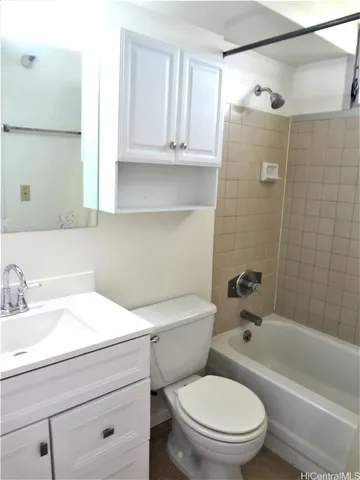 a bathroom with a sink a toilet and a bathtub