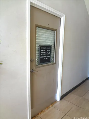 a view of a hallway with a white door
