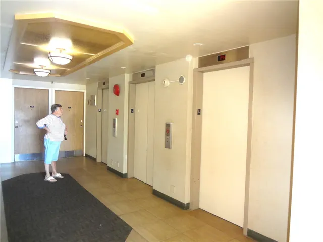 a view of a bathroom from a hallway