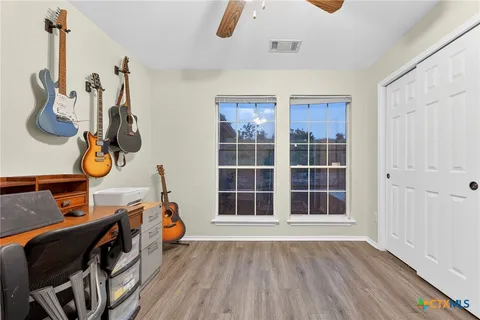 a view of an entryway with wooden floor