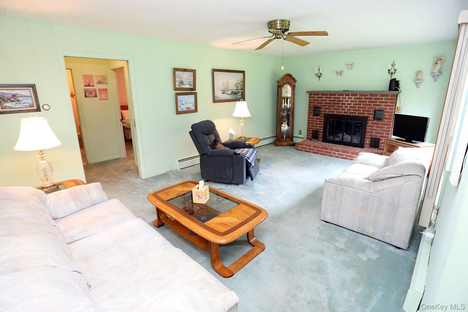 9568 Highway 97 Callicoon, NY 12723 - Photo 14 of 50 a living room with furniture and a fireplace