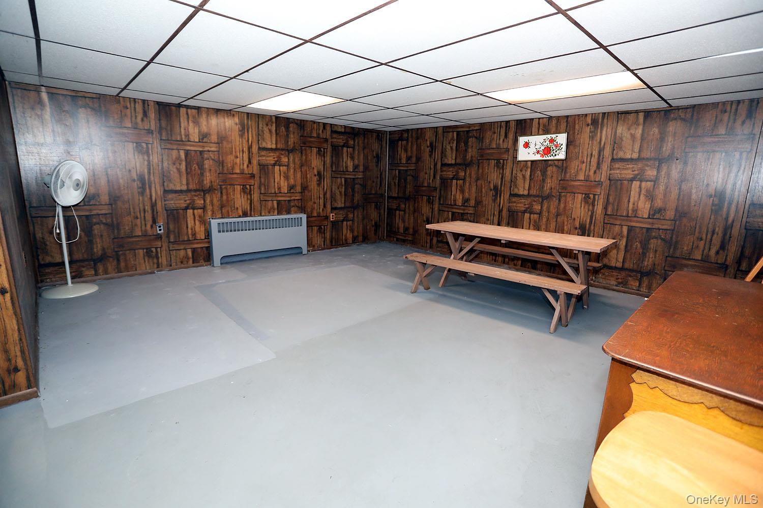 9568 Highway 97 Callicoon, NY 12723 - Photo 34 of 50 a bedroom with furniture and a chandelier