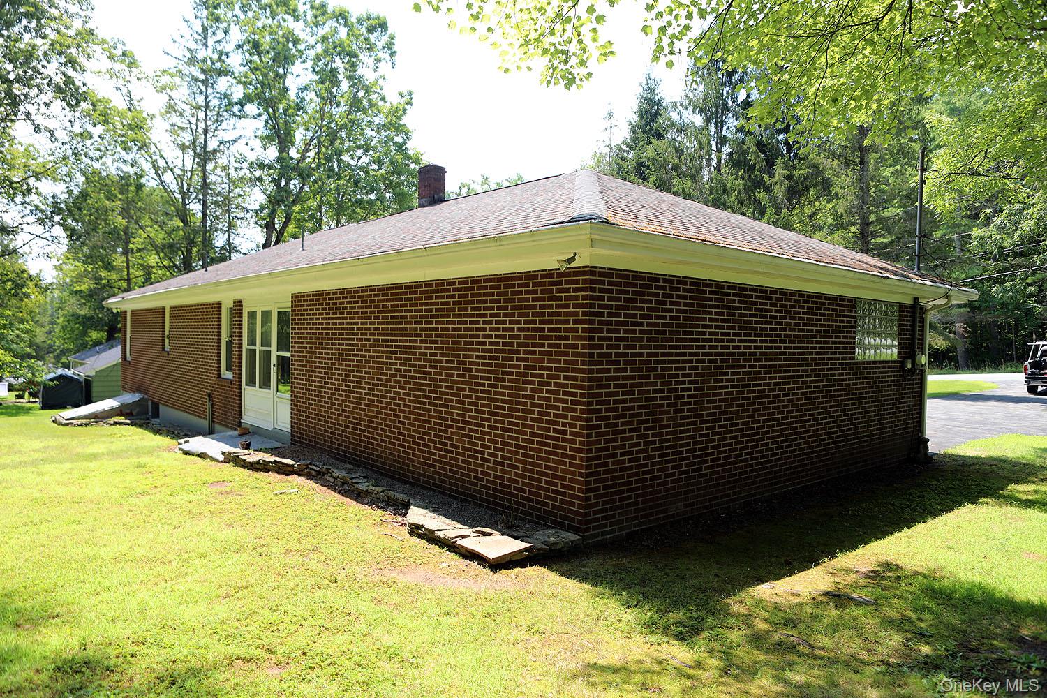 9568 Highway 97 Callicoon, NY 12723 - Photo 48 of 50 a back view of a house with a yard