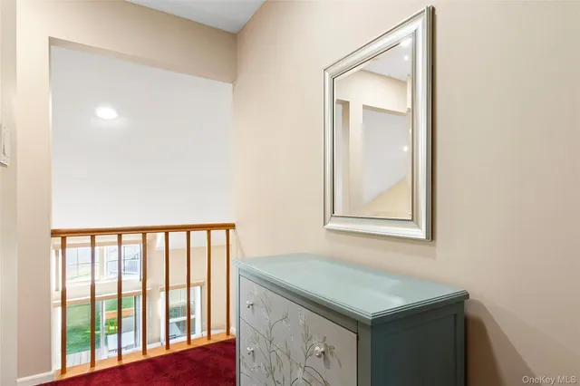 a bathroom with a sink vanity and a window