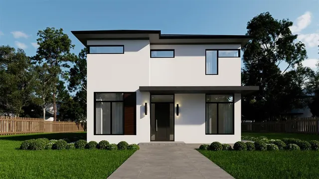 a front view of a house with a garden