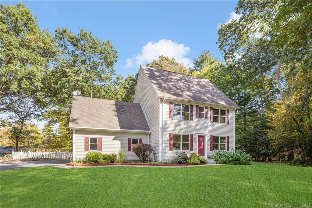 32 Ladds Lane Killingly, CT 06241 - Photo 1 of 1 a front view of a house with a garden and plants