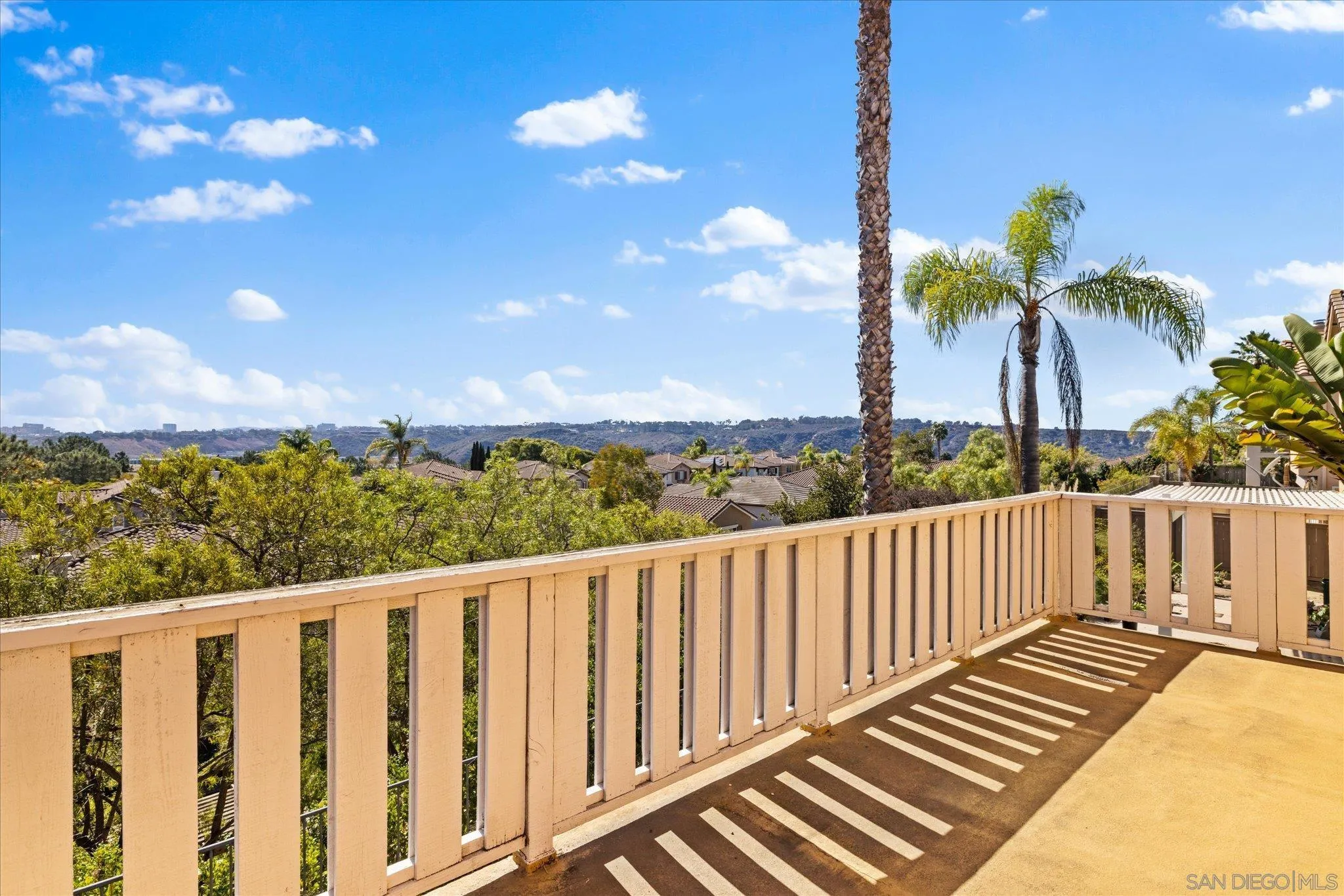 3971 Via Cangrejo San Diego, CA 92130 - Photo 13 of 26 a view of a balcony with wooden fence