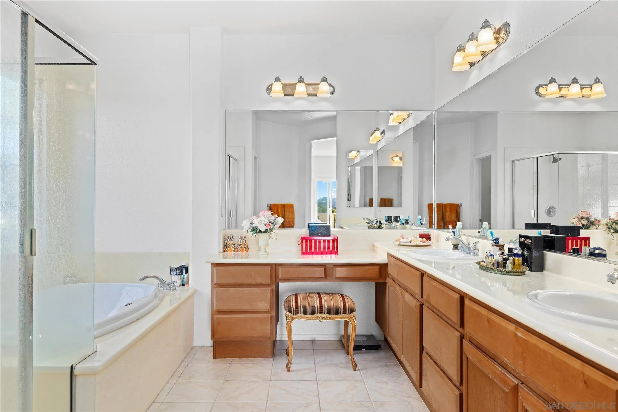 3971 Via Cangrejo San Diego, CA 92130 - Photo 14 of 26 a bathroom with a sink vanity tub and a shower