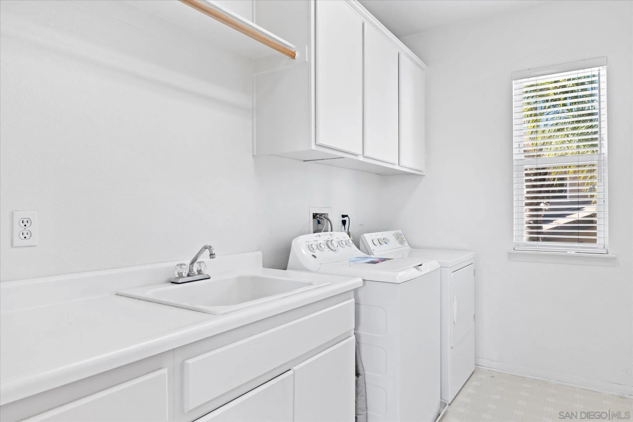 3971 Via Cangrejo San Diego, CA 92130 - Photo 15 of 26 a utility room with dryer and washer
