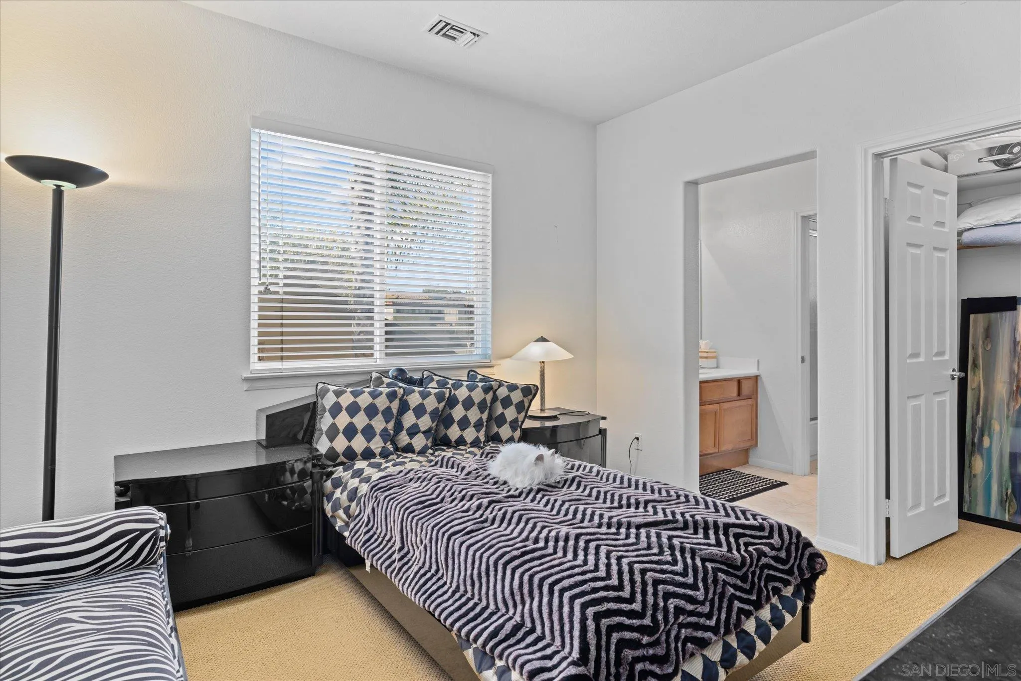 3971 Via Cangrejo San Diego, CA 92130 - Photo 17 of 26 a bedroom with a bed and a window