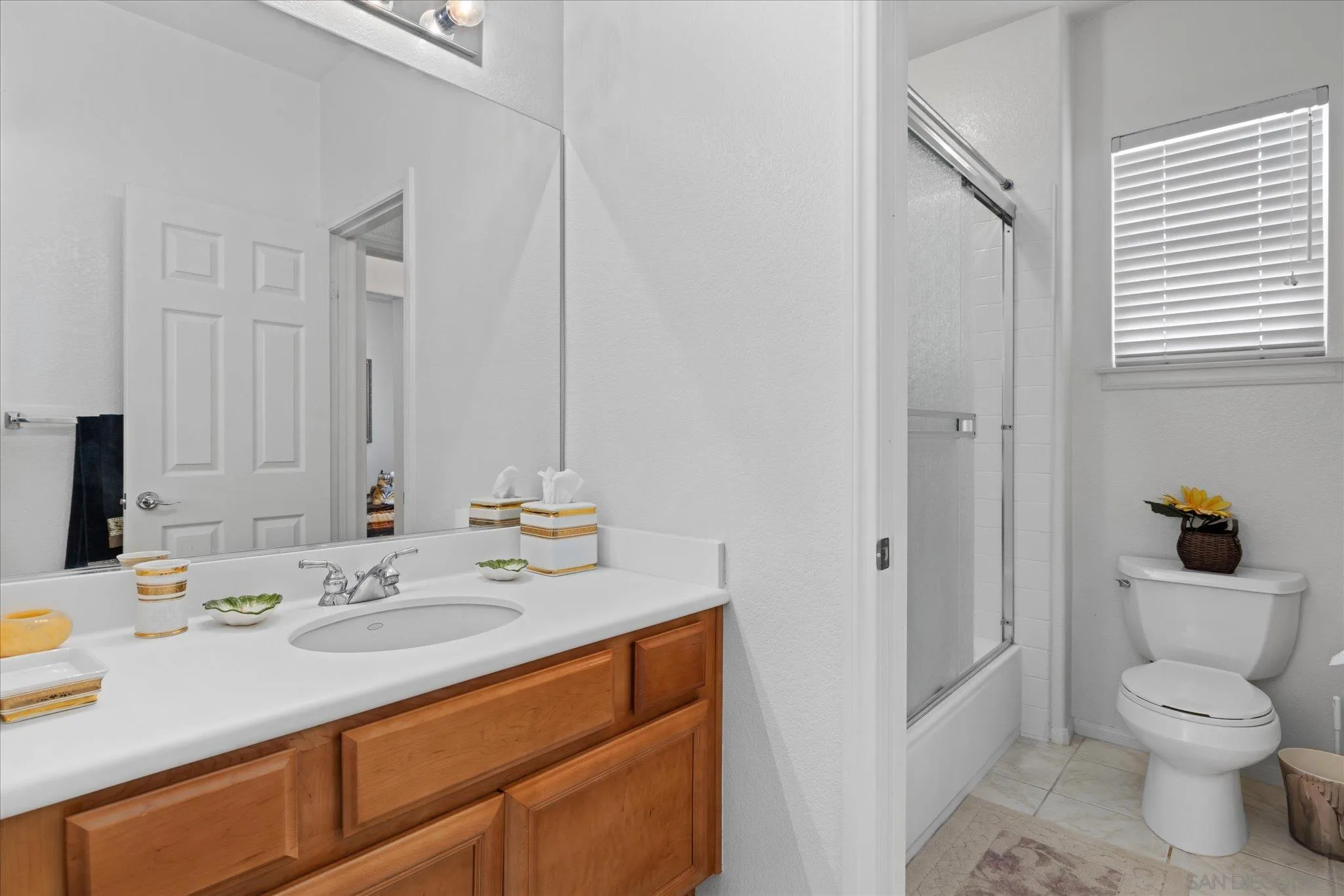 3971 Via Cangrejo San Diego, CA 92130 - Photo 19 of 26 a bathroom with a sink toilet and shower