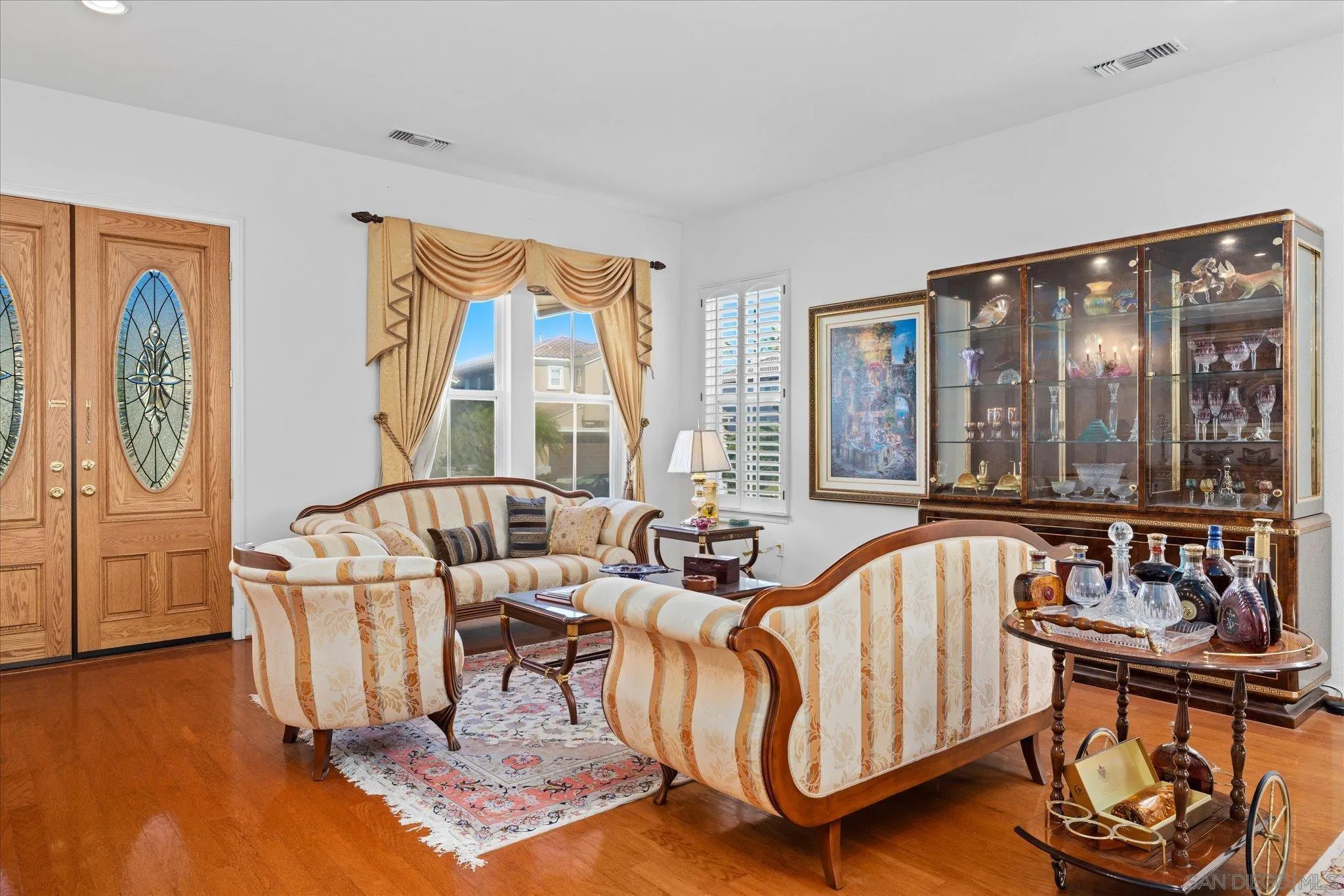 3971 Via Cangrejo San Diego, CA 92130 - Photo 4 of 26 a living room with furniture and a large window