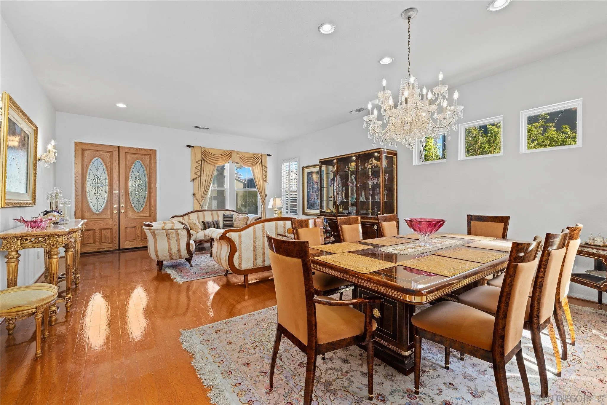 3971 Via Cangrejo San Diego, CA 92130 - Photo 5 of 26 a view of a dining room with furniture window and wooden floor