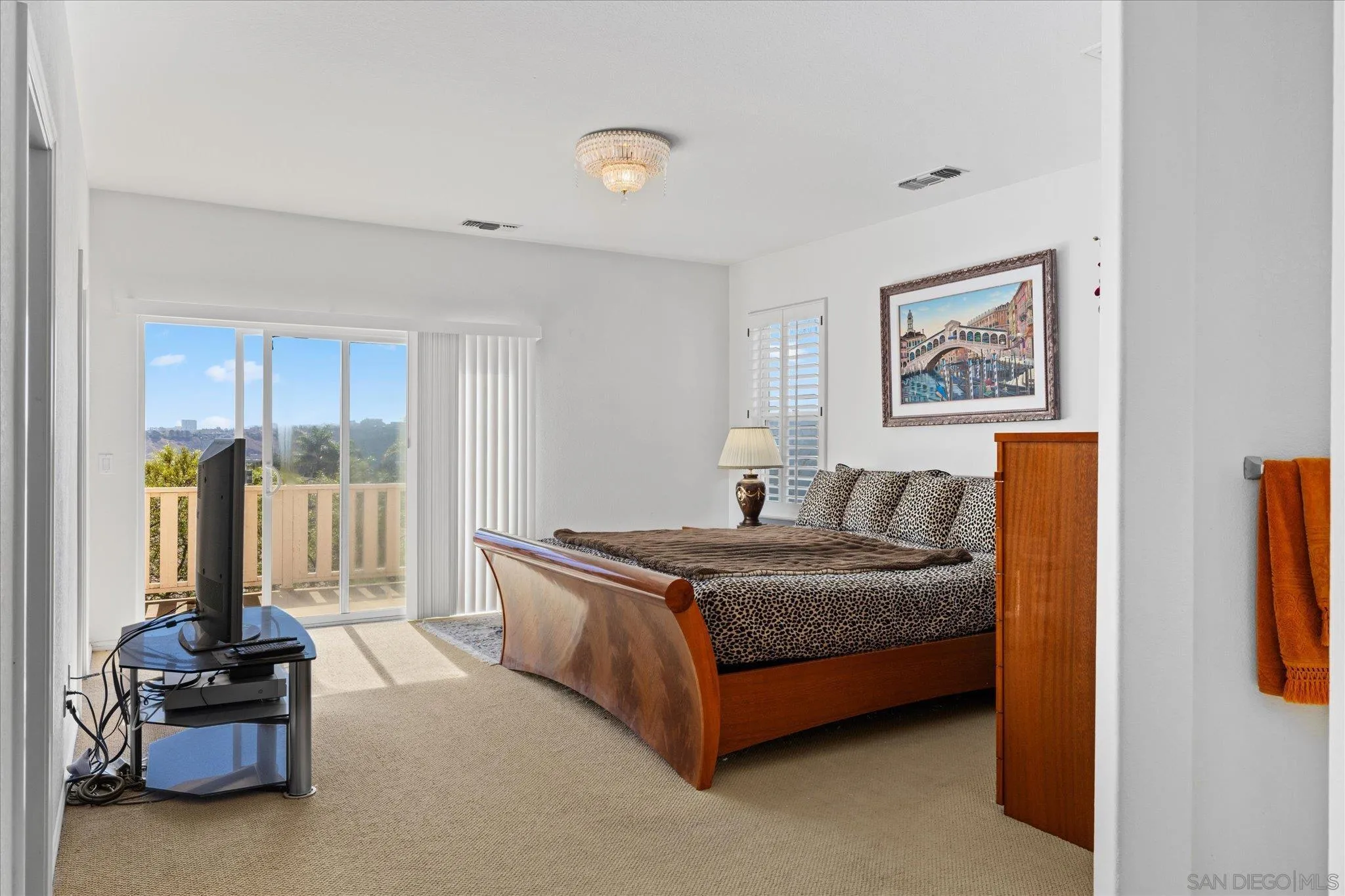 3971 Via Cangrejo San Diego, CA 92130 - Photo 10 of 26 a living room with a bed furniture and a large window