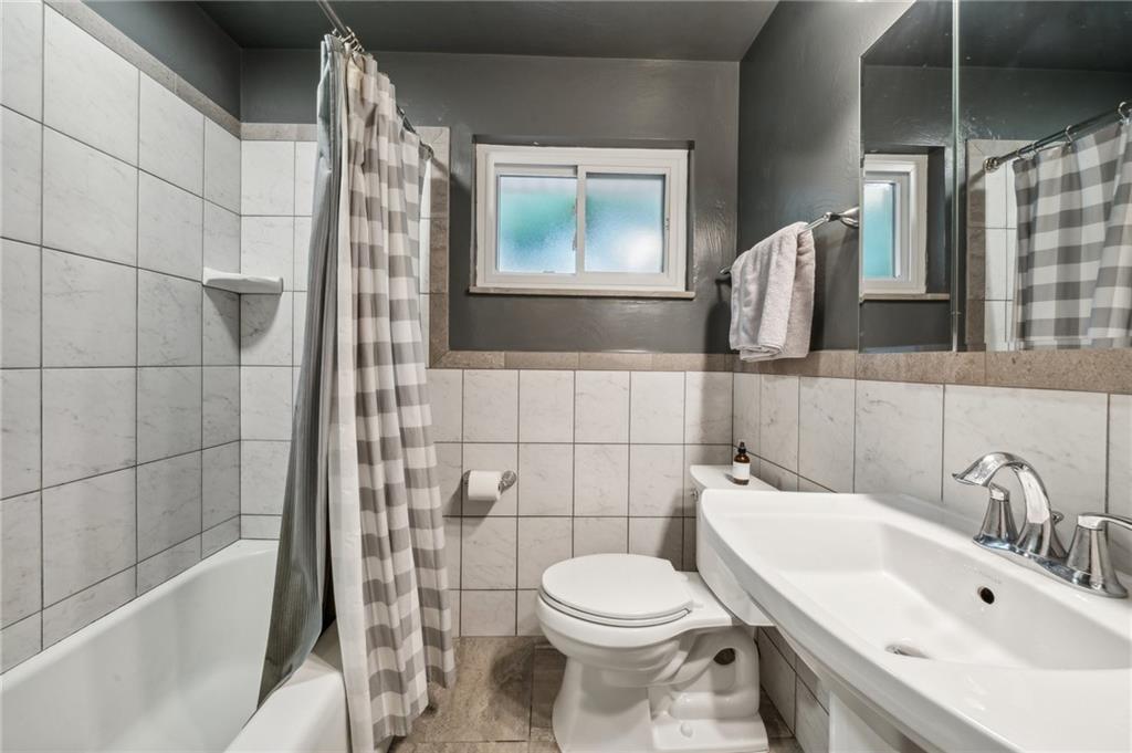 1492 Anderson Road Pittsburgh, PA 15209 - Photo 15 of 46 a bathroom with a sink toilet and shower