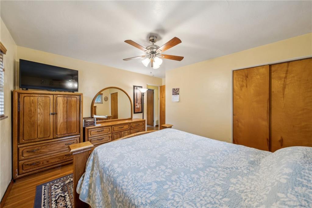 1492 Anderson Road Pittsburgh, PA 15209 - Photo 19 of 46 a bedroom with a bed and a flat screen tv