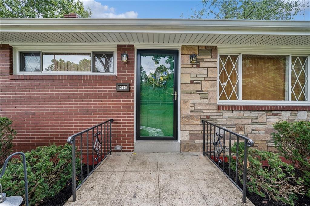 1492 Anderson Road Pittsburgh, PA 15209 - Photo 41 of 46 a front view of a house with a garage
