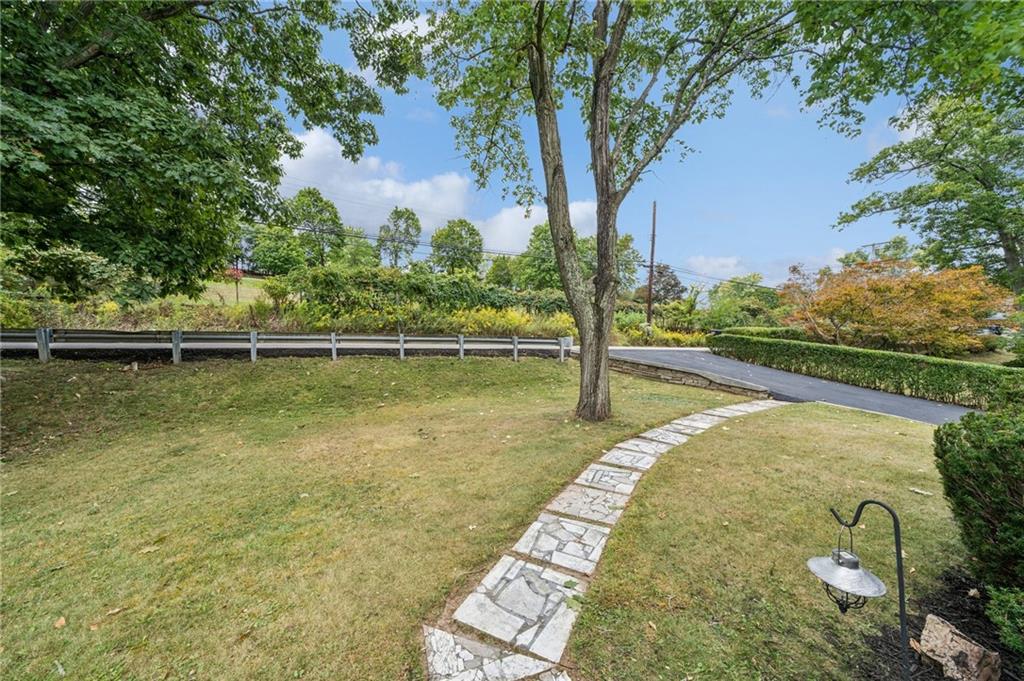 1492 Anderson Road Pittsburgh, PA 15209 - Photo 42 of 46 a view of a lake with a yard and large trees