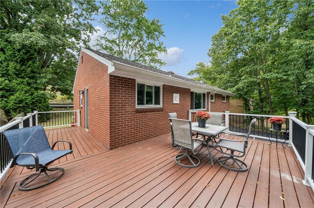 1492 Anderson Road Pittsburgh, PA 15209 - Photo 5 of 46 a view of deck with table and chairs and wooden floor
