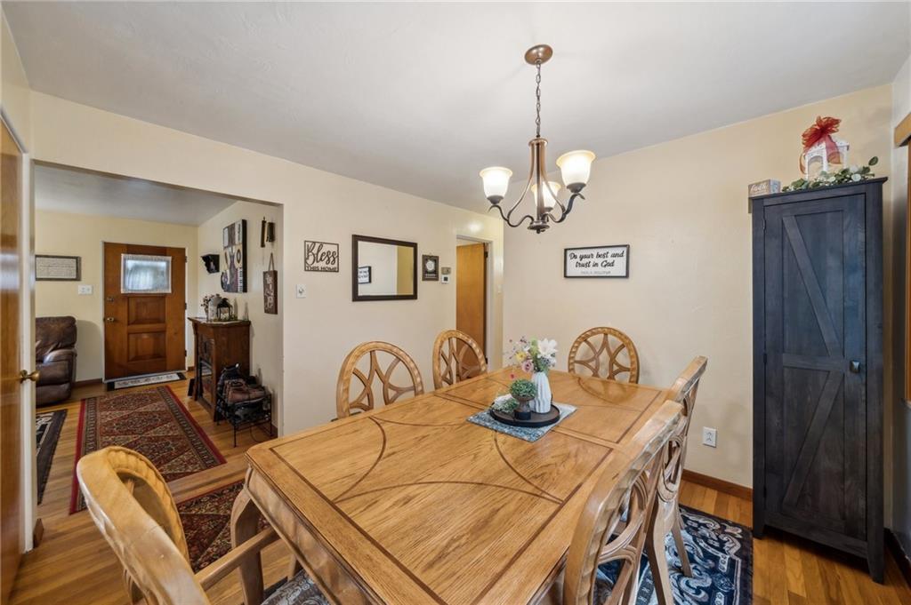 1492 Anderson Road Pittsburgh, PA 15209 - Photo 9 of 46 a view of a dining room with furniture and wooden floor
