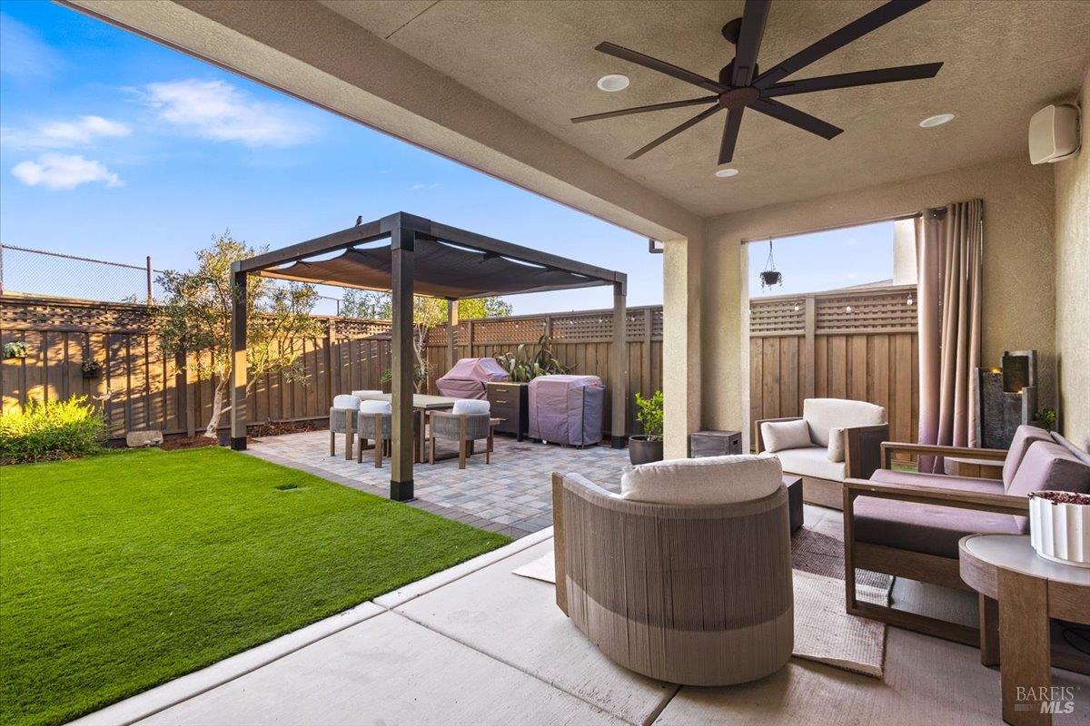 1469 Oak Circle Rohnert Park, CA 94928 - Photo 34 of 42 Indoor-Outdoor Living at Its Best Large sliding doors open to a covered outdoor living room complete with ceiling fan, built-in speakers, and comfortable entertaining space for year-round enjoyment.